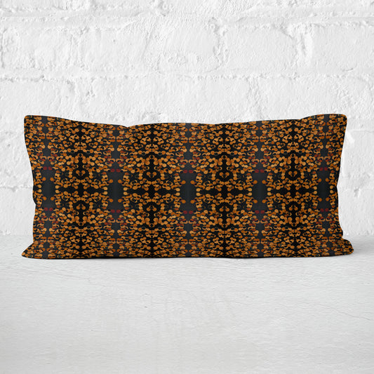 Rectangular lumbar pillow featuring a hand-painted black and copper tone pattern.