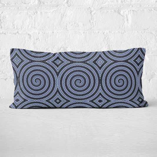 Rectangular lumbar pillow featuring hand-painted and collaged blue and white spiral pattern.