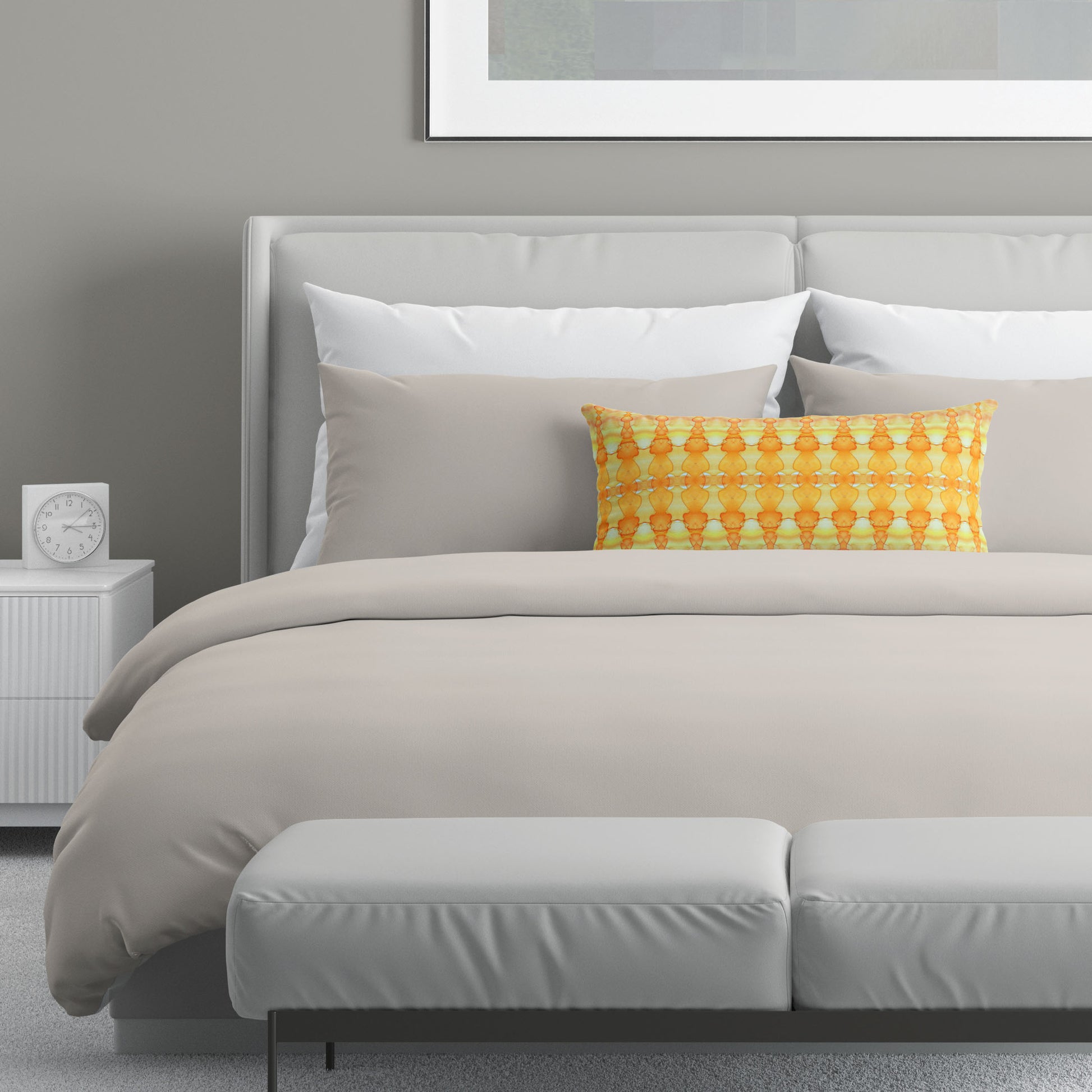 Neutral colored bedroom featuring a bed with an abstract yellow patterned lumbar pillow.