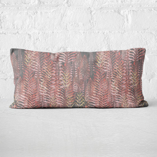 12 x 24 inch lumbar pillow featuring feather block print in pink and gray tones.